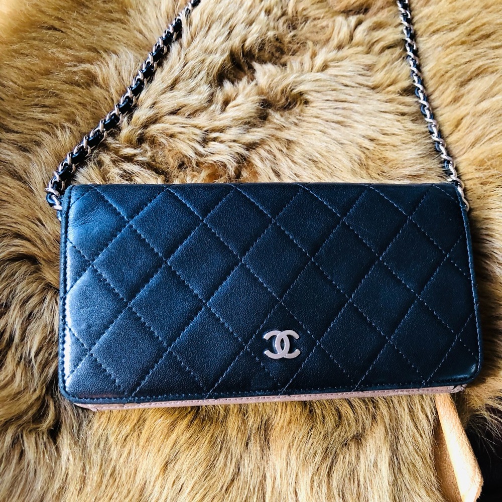 Authentic black lambskin Chanel crossbody bag.